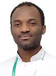 Врач Мфабо Куенджин Дагобер